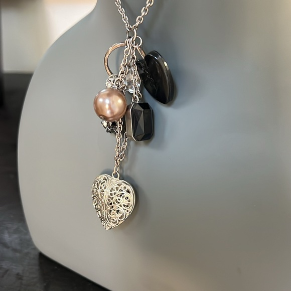 Long silver toned necklace with 8 charms in black and silver heart bead ring - Picture 5 of 9